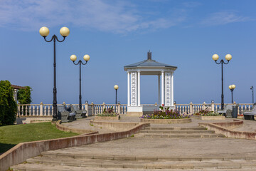 Elegant white pavilion on the new promenade in Sillam&auml;e (Sillamae), Estonia, overlooking the Baltic Sea on a sunny summer day. Travel, tourism, architecture, summer leisure, coastal lifestyle concept.