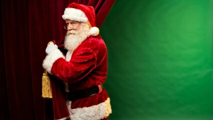 Santa character peeking from behind red velvet curtain on green screen studio background, playful holiday reveal concept for Christmas marketing, greeting cards and festive promotions - Powered by Adobe