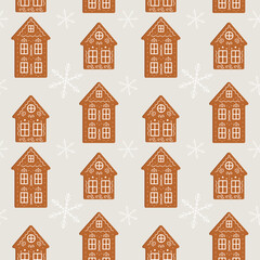 Fototapeta premium Festive seamless Christmas pattern with traditional gingerbread houses decorated with white icing and snowflakes. Perfect for holiday textiles, wrapping paper and digital decor. Vector 