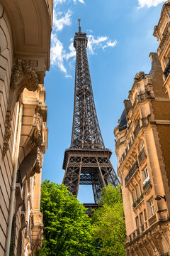 Paris France Eiffel Tower seen through historic city buildings