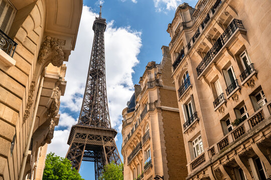 Paris France Eiffel Tower seen through historic city buildings