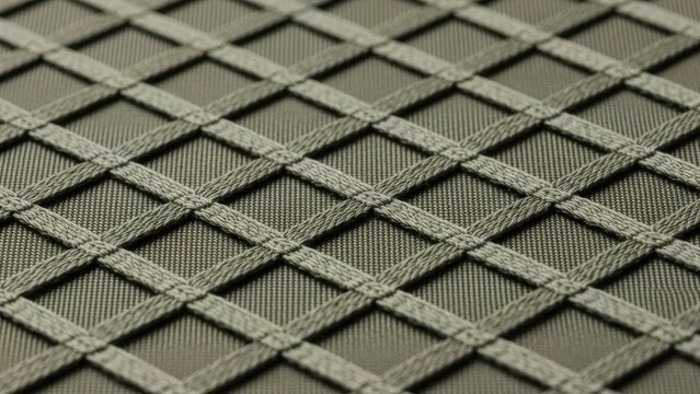 Muted green material with embossed diamond grid texture