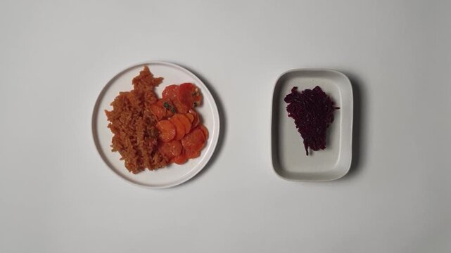 Plating Rice with Spicy Carrots and Beetroot on White Plate