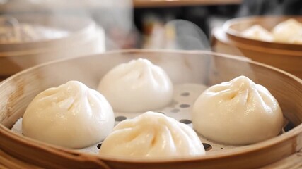 Steaming Hot Chinese Buns in Bamboo Steamer A CloseUp of Freshly Cooked Bao Buns Showcasing Traditional Asian Cuisine and Culinary Artistry Perfect for Food Blogs and Restaurant Promotions.