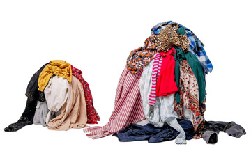 Two piles of second-hand clothes. Sorting used clothes.