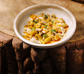 Delicious pasta dish served on a rustic wooden table with fresh ingredients