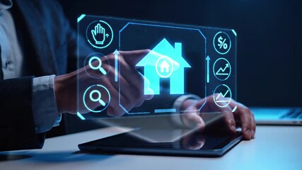 Professional using tablet with holographic real estate interface featuring house and property search tools. Digital platform displays mortgage percentage, market analytics and listing visualization