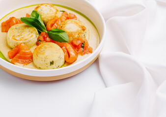 Delicious dish featuring creamy cottage cheese pancakes and fresh tomato salad