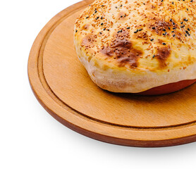 Freshly baked bread served on a wooden plate with sesame topping