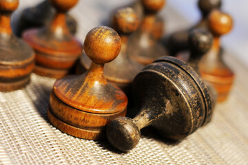 Old retro wooden chess pieces, intellectual strategy game.