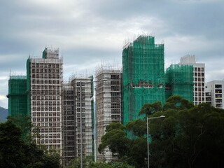 Bamboo scaffolding with building under construction with scaffolding, Hongkong Construction Safety, bamboo sticks