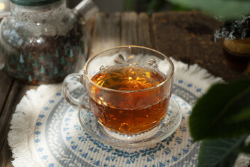 Tea party. Cup of warm tea on rustic table