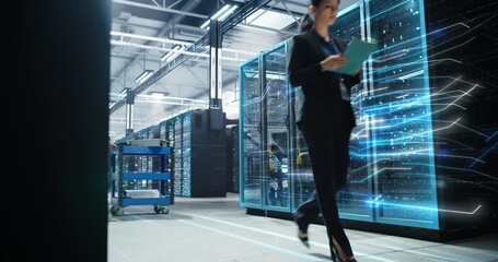Female IT Specialist Walks Through a Data Center, Checking a Digital Tablet While Holographic Data Stream Lines on Server Racks, Illustrating Analytics, Cloud Processing, Cybersecurity Monitoring - Powered by Adobe