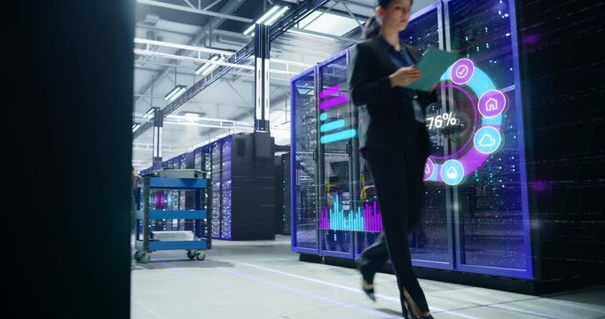 Female IT Engineer Strides Through a Futuristic Data Center, Reviewing Analytics on a Digital Tablet While Holographic Infographics Overlay Server Racks, Tracking Cloud Services Cyber security
