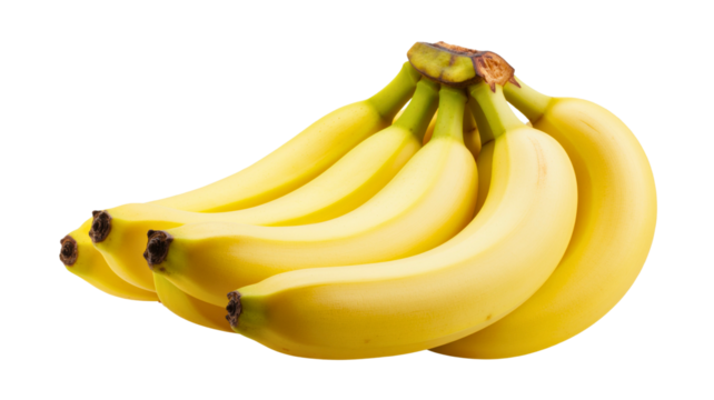 A bunch of fresh ripe yellow bananas isolated on a solid black background in studio setting