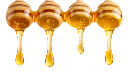 Golden honey dripping viscous liquid isolated on a transparent background amber