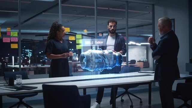 Diverse Team of Engineers Collaborates in Office, Using Mixed Reality Holograms to Inspect Detailed Turbine Engine Model, Discussing Virtual Prototyping, Innovation for Advanced Industrial Engineering