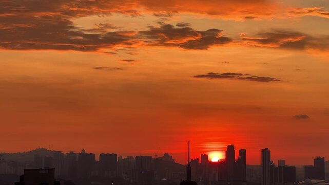 Kuala Lumpur, Malaysia, June 8, 2025: Sunset from an observation deck in Kuala Lumpur. Sunset sky illuminated by twilight, TV tower, and high-rise buildings from the air in the city center. 4K