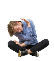 Side view scared teenage guy seated on the floor keeps hands raised to protect him from danger, full length sitting teen isolated on transparent background. Helpless adolescent victim of bullying