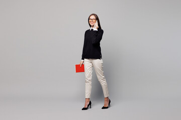 Full body young employee business woman corporate lawyer she wear black sweater glasses shirt work...