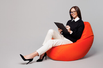Full body young employee business woman corporate lawyer in black clothes glasses shirt work in...