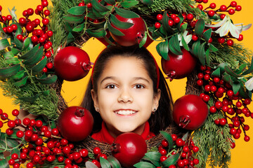 Merry little girl wear red clothes fun decorative deer horns on head posing look through handmade...