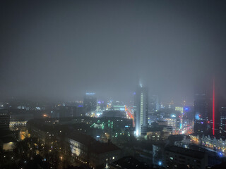 Fototapeta premium Foggy late autumn Tornimäe cityscape at night, Tallinn, Harjumaa, Estonia, November 2019