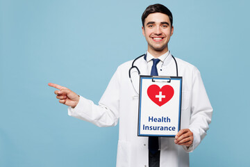 Young male doctor man wear white medical gown suit work in hospital clinic office hold in hands...