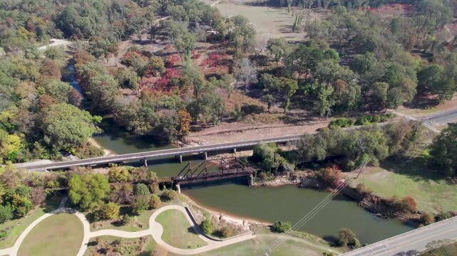 Aerial video of the Howe Truss Railroad Bridge over the Big Cypress Bayou in Jefferson, Texas