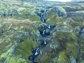 Aerial view around the Klifbrekku kaskade falls - Mjóifjörður fjord - Iceland