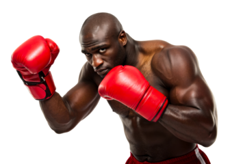 Powerful Black male boxer in fighting stance wearing red gloves, ideal for sports, fitness, and actionthemed campaigns.