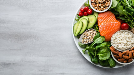 Fresh balanced diet bowl with salmon avocado greens nuts and grains