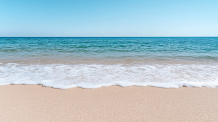 Fototapeta premium Clean coastline with gentle waves and soft sand evoking calmness