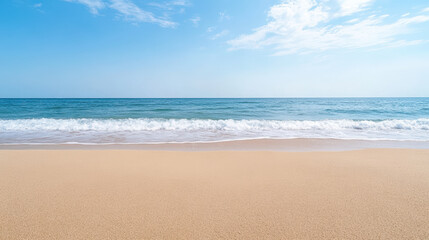 Fototapeta premium Serene sandy beach with gentle waves and clear blue sky, peaceful summer seascape