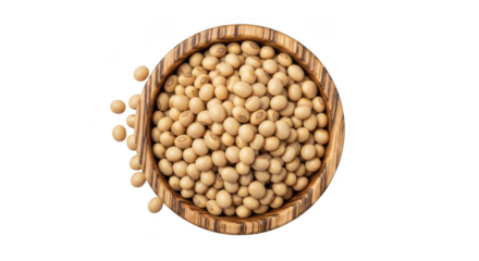 Overhead view of a wooden bowl filled with dried chickpeas scattered on a dark surface