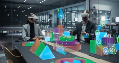 Analyst and Analyst in VR Headsets Sit in a Glass Office, Interactively Exploring Holographic Dashboards, 3d Charts, and Financial Metrics, Using Immersive Virtual Reality Data Visualization - Powered by Adobe