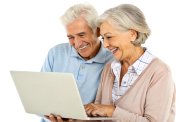 Happy senior couple looking at a laptop screen together smiling while browsing the internet or making a video call for technology and retirement lifestyle concepts