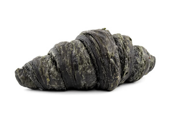 Black charcoal croissant on a light background