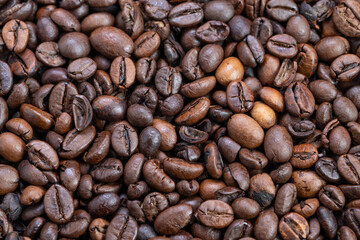 Vivid spotlight highlights coffee beans, Enhancing contrast with striking lighting emphasizes oilsheened espresso beans perfect for marketing and promotional visuals