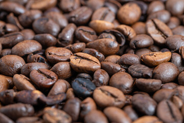 Brightly polished coffee seeds gleaming, Lustrous coffee beans with shiny surface gleam, Coffee beans exhibiting highly glossy and reflective surface with attractive sheen