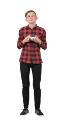 Focused adolescent boy playing video games, full length portrait isolated on transparent background. Intent teen guy stand all ears holding a joystick console looks attentive try to win