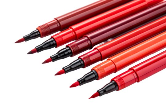 A row of six vibrant red brush pens with black caps arranged diagonally on a white surface for art and calligraphy projects