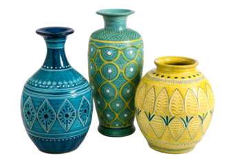 Three vibrantly colored ceramic vases with unique textured surfaces and decorative motifs displayed on a plain surface for home decor or retail use