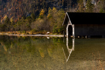 Wooden shed on lake Konigsee in an autumn scenery in the Bavarian Alps