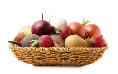 Many different raw vegetables in wicker basket isolated on white