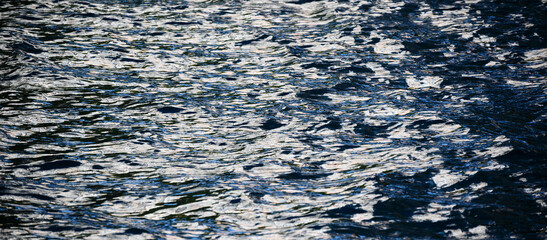 Glittering sea surface under bright sunlight.