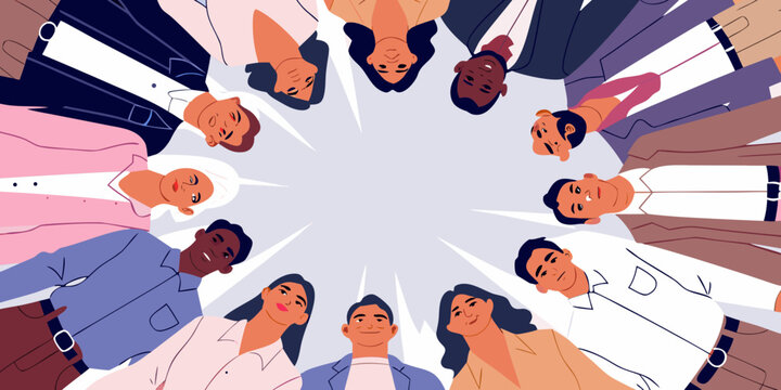 Diverse team of professionals in a huddle looking down with copy space