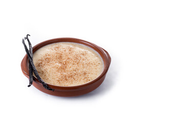 Creamy homemade Spanish custard served in a bowl with cinnamon isolated on white background. Copy space