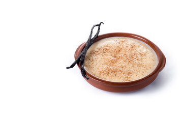 Creamy homemade Spanish custard served in a bowl with cinnamon isolated on white background. Copy space