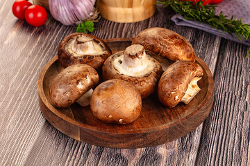 Raw brown champignon heap for cooking